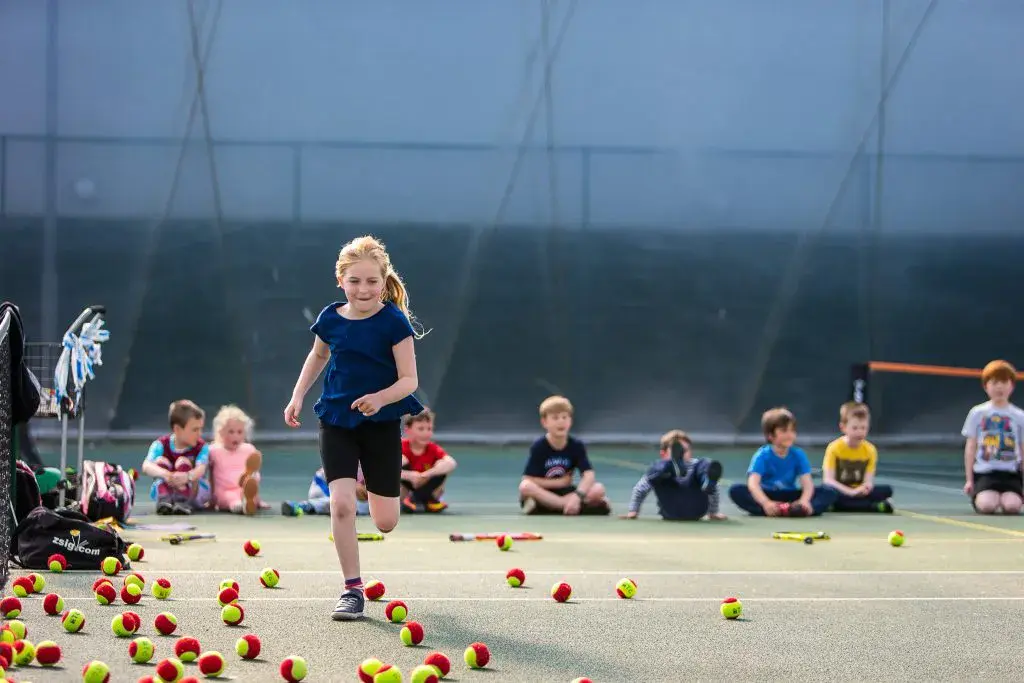 Girls and boy taking part in holiday activities