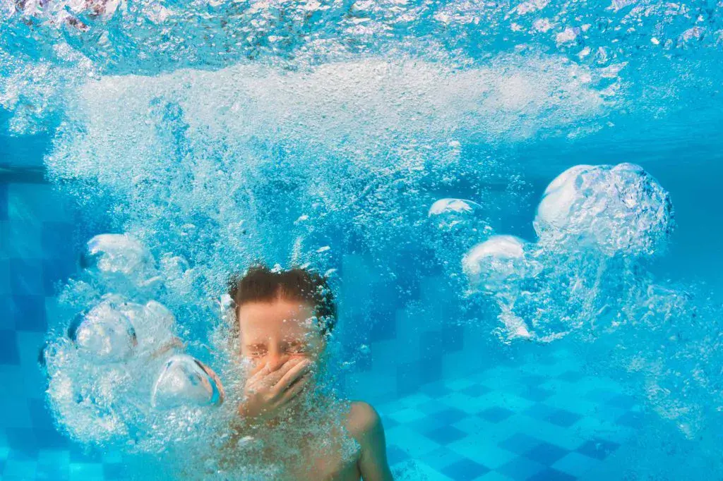 Boy under water and bubbles galore!