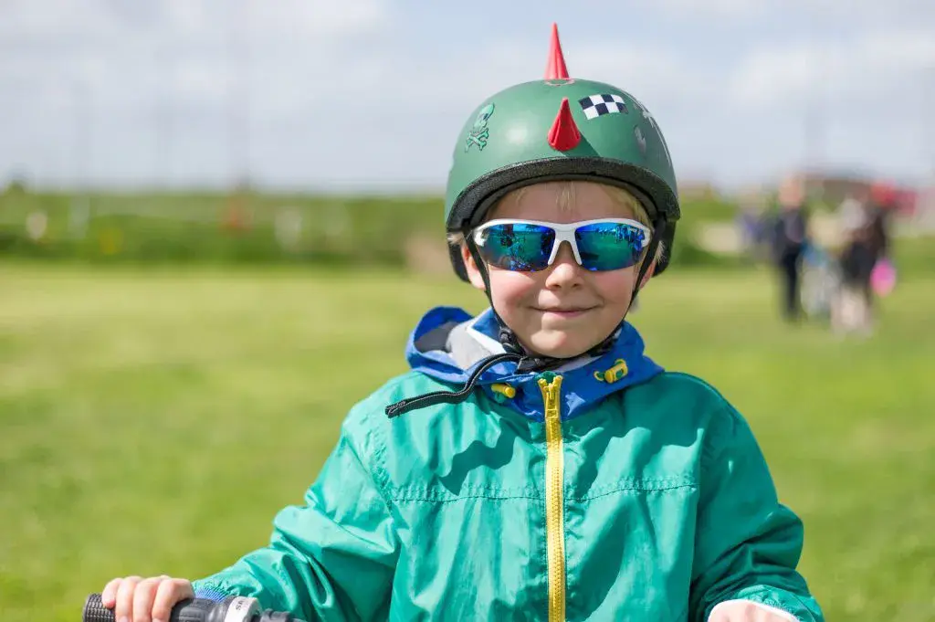 Child with cool bike helmet on